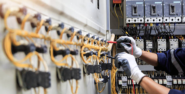 Professional Electrician technician working in Oriole Beach, FL
